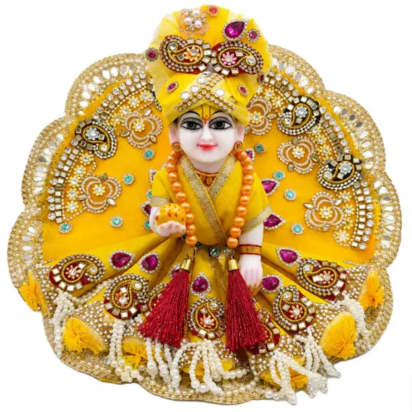 Beautiful Laddu Gopal Dress For Janmastmi in bright yellow featuring intricate mirror work, magenta kundan stones, and matching pagri.
